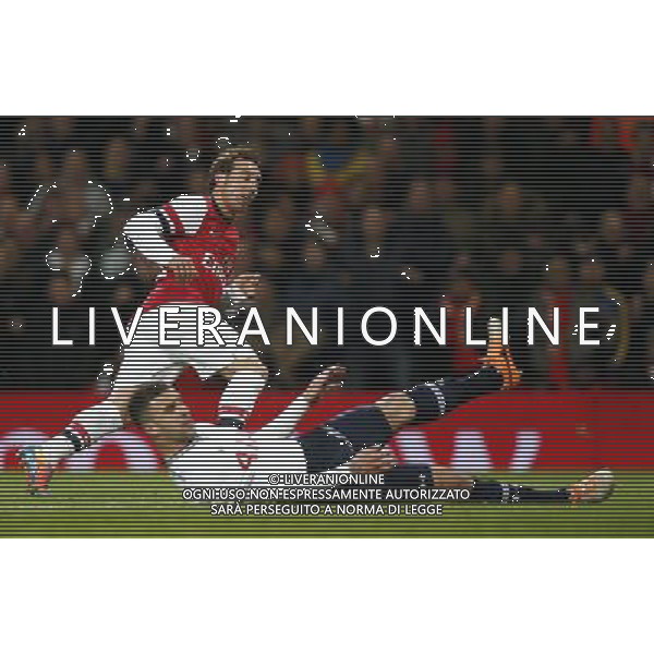 (140105) -- LONDON, Jan. 5, 2014 () -- Santi Cazorla (L) of Arsenal celebrates scoring during FA Cup Third Round match between Arsenal and Tottenham Hotspur at Emirates Stadium in London, Britain on Jan. 4, 2014. Arsenal won 2-0. (/Wang Lili) FOR EDITORIAL USE ONLY. NOT FOR SALE FOR MARKETING OR ADVERTISING CAMPAIGNS. NO USE WITH UNAUTHORIZED AUDIO, VIDEO, DATA, FIXTURE LISTS, CLUBLEAGUE LOGOS OR LIVE SERVICES. ONLINE IN-MATCH USE LIMITED TO 45 IMAGES, NO VIDEO EMULATION. NO USE IN BETTING, GAMES OR SINGLE CLUBLEAGUEPLAYER PUBLICATIONS. AG ALDO LIVERANI SAS ONLY ITALY