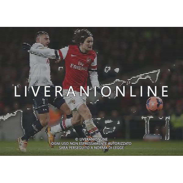 (140105) -- LONDON, Jan. 5, 2014 () -- Tomas Rosicky(R) of Arsenal scores during FA Cup Third Round match between Arsenal and Tottenham Hotspur at Emirates Stadium in London, Britain on Jan. 4, 2014. Arsenal won 2-0. (/Wang Lili) FOR EDITORIAL USE ONLY. NOT FOR SALE FOR MARKETING OR ADVERTISING CAMPAIGNS. NO USE WITH UNAUTHORIZED AUDIO, VIDEO, DATA, FIXTURE LISTS, CLUBLEAGUE LOGOS OR LIVE SERVICES. ONLINE IN-MATCH USE LIMITED TO 45 IMAGES, NO VIDEO EMULATION. NO USE IN BETTING, GAMES OR SINGLE CLUBLEAGUEPLAYER PUBLICATIONS. AG ALDO LIVERANI SAS ONLY ITALY