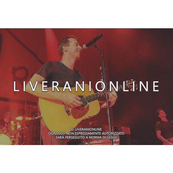  Coldplay on stage at the \'Under 1 Roof\' concert, held at Hammersmith Apollo, London, on Thursday December 19, 2013. AG ALDO LIVERANI SAS ONLY ITALY