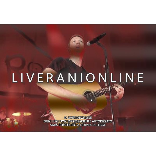  Coldplay on stage at the \'Under 1 Roof\' concert, held at Hammersmith Apollo, London, on Thursday December 19, 2013. AG ALDO LIVERANI SAS ONLY ITALY