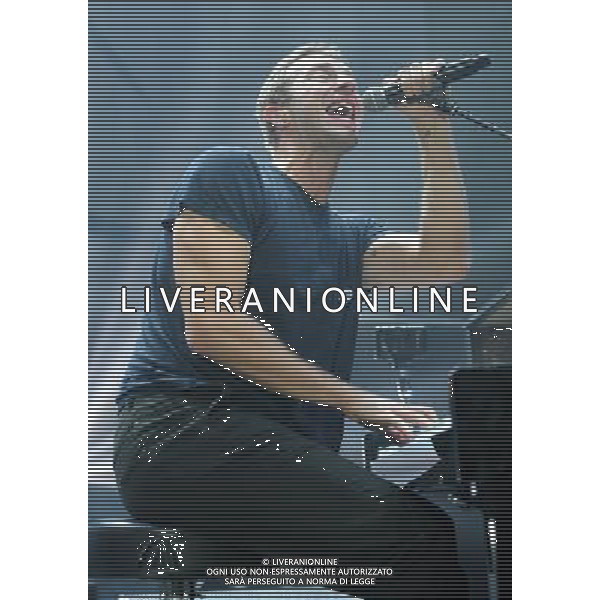  Coldplay on stage at the \'Under 1 Roof\' concert, held at Hammersmith Apollo, London, on Thursday December 19, 2013. AG ALDO LIVERANI SAS ONLY ITALY