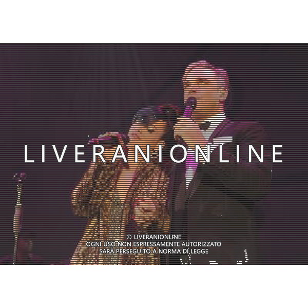  Lily Allen and Robbie Williams on stage at the \'Under 1 Roof\' concert, held at Hammersmith Apollo, London, on Thursday December 19, 2013. AG ALDO LIVERANI SAS ONLY ITALY