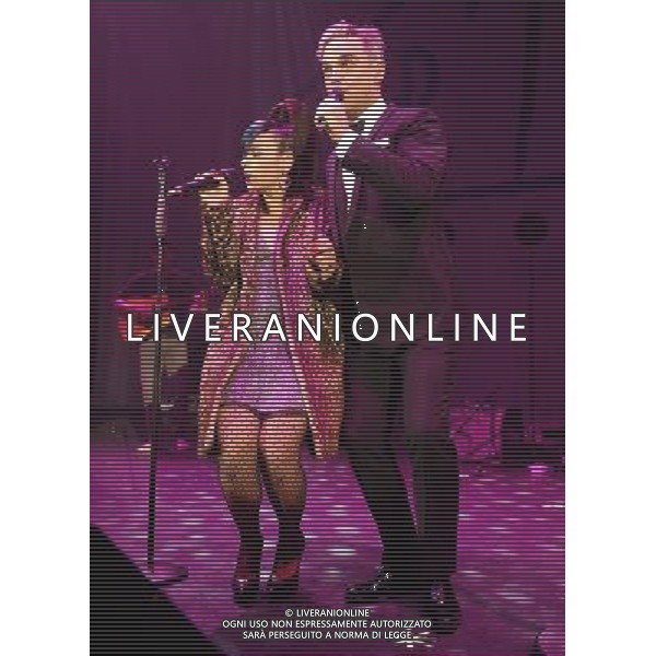  Lily Allen and Robbie Williams on stage at the \'Under 1 Roof\' concert, held at Hammersmith Apollo, London, on Thursday December 19, 2013. AG ALDO LIVERANI SAS ONLY ITALY