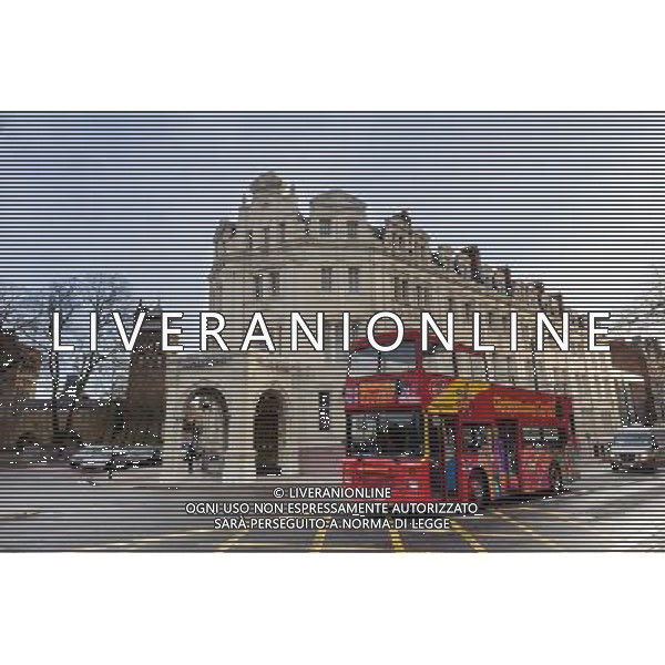 A red bus seen in Cardiff City Centre passing the historic Angel Hotel and Cardiff Castle Cardiff City ©Photoshot/Ag. Aldo Liverani s.a.s.-Only Italy-Editorial Use Only