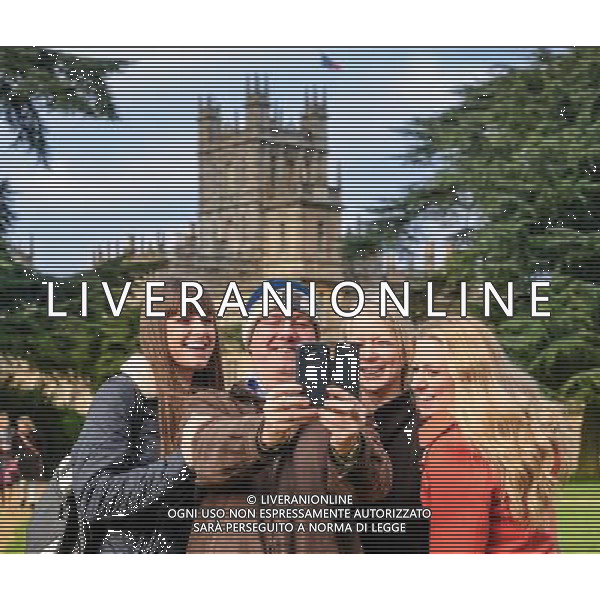 The ultimate selfie: A family stand to pose in front of Highclere Castle, which is the fictional Downton Abbey on a day the castle is open to the public. Downton Abbey open day ©Photoshot/Ag. Aldo Liverani s.a.s.-Only Italy-Editorial Use Only