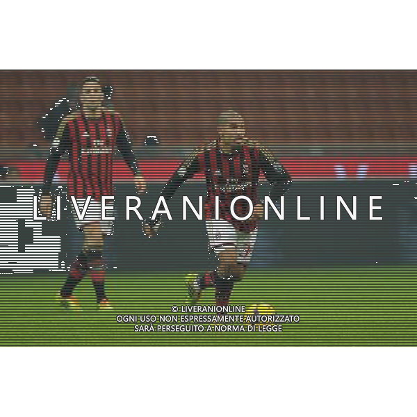 Milano 22-01-2014 TIM Cup - Coppa Italia quarti di finale Stadio Giuseppe Meazza - San Siro Milan - Udinese nella foto Nigel De Jong (Milan) e a SX Adil Rami (Milan) foto Roberto Garavaglia - ag. Aldo Liverani sas