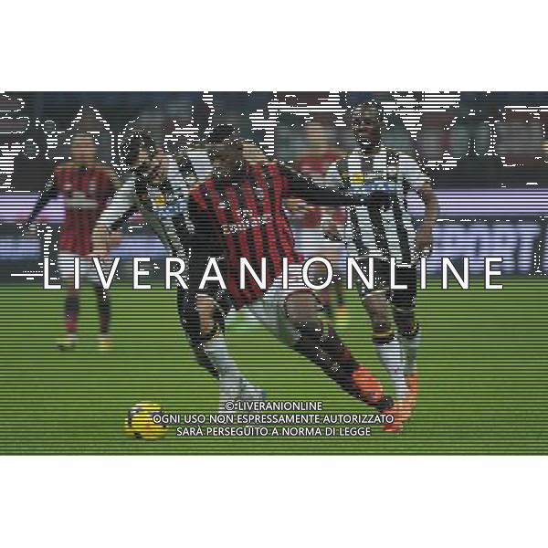Milano 22-01-2014 TIM Cup - Coppa Italia quarti di finale Stadio Giuseppe Meazza - San Siro Milan - Udinese nella foto Mario Balotelli (Milan) tra Maurizio Domizzi (Udinese) a SX ed Emmanuel Badu (Udinese) a DX foto Roberto Garavaglia - ag. Aldo Liverani sas