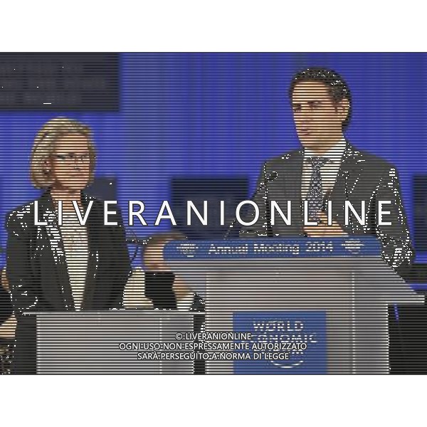 DAVOS/SWITZERLAND, 21JAN14 - Juan Diego Florez (R), Tenor and Founder, Sinfonia por el Peru, Peru speaks after receiving the crystal award from Hilde Schwab (L), Chairperson and Co-Founder, Schwab Foundation for Social Entrepreneurship, Switzerland during the \'Crystal Awards Ceremony\' at the Annual Meeting 2014 of the World Economic Forum at the congress centre in Davos, January 21, 2014. WORLD ECONOMIC FORUM/swiss-image.ch/Photo Jolanda Flubacher Â©Photoshot/Ag. Aldo Liverani s.a.s.-Only Italy-Editorial Use Only