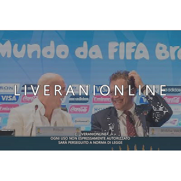 (140124) -- RIO DE JANEIRO, Jan. 24, 2014 () -- FIFA Secretary General Jerome Valcke (R) and U.S. pop singer Pitbull interact during a press conference after a regular meeting of FIFA Local Organizing Comittee (LOC) in Rio de Janeiro, Brazil, Jan. 23, 2014. FIFA LOC announced here on Thursday that U.S. pop singers Jennifer Lopez, Pitbull and Brazilian singer Claudia Leitte will jointly sing the official theme song \'We Are One\' for the 2014 FIFA World Cup. (/Xu Zijian) ©Photoshot/Ag. Aldo Liverani s.a.s.-Only Italy-Editorial Use Only