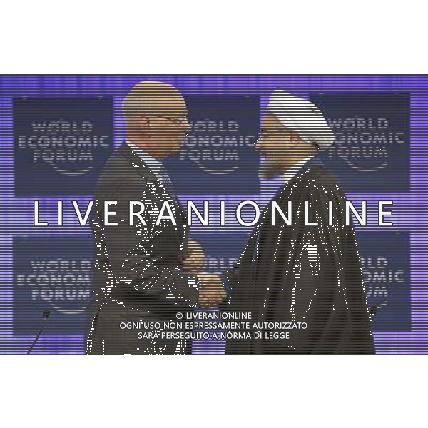 Hassan Rouhani (R), President of the Islamic Republic of Iran shakes hands with Klaus Schwab, Founder and Executive Chairman, World Economic Forum before the session \'Iran in the World\' at the Annual Meeting 2014 of the World Economic Forum at the congress centre in Davos, January 23, 2014. WORLD ECONOMIC FORUM/swiss-image.ch/Photo RÈmy Steinegger ©Photoshot/Ag. Aldo Liverani s.a.s.-Only Italy-Editorial Use Only