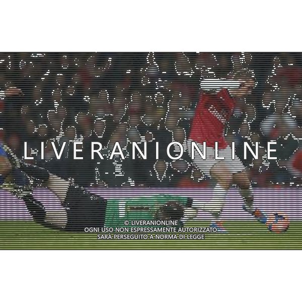 BRITAIN-LONDON-SOCCER-FA CUP-ARSENAL VS COVENTRY (140125) -- LONDON, Jan. 25, 2014 () -- Lukas Podolski(R) of Arsenal scores his first goal after passing Joe Murphy, the goalie of Coventry City during FA Cup Fourth Round match between Arsenal and Coventry City at Emirates Stadium in London, Britain on Jan. 24, 2014. Arsenal won 4-0. (/Wang Lili) FOR EDITORIAL USE ONLY. NOT FOR SALE FOR MARKETING OR ADVERTISING CAMPAIGNS. NO USE WITH UNAUTHORIZED AUDIO, VIDEO, DATA, FIXTURE LISTS, CLUBLEAGUE LOGOS OR LIVE SERVICES. ONLINE IN-MATCH USE LIMITED TO 45 IMAGES, NO VIDEO EMULATION. NO USE IN BETTING, GAMES OR SINGLE CLUBLEAGUEPLAYER PUBLICATIONS. AG ALDO LIVERANI SAS ONLY ITALY