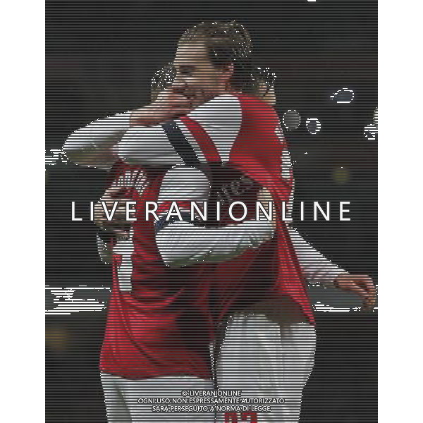 (140125) -- LONDON, Jan. 25, 2014 () -- Nicklas Bendtner(R) of Arsenal congratulates Lukas Podolski scoring second goal during FA Cup Fourth Round match between Arsenal and Coventry City at Emirates Stadium in London, Britain on Jan. 24, 2014. Arsenal won 4-0. (/Wang Lili) FOR EDITORIAL USE ONLY. NOT FOR SALE FOR MARKETING OR ADVERTISING CAMPAIGNS. NO USE WITH UNAUTHORIZED AUDIO, VIDEO, DATA, FIXTURE LISTS, CLUBLEAGUE LOGOS OR LIVE SERVICES. ONLINE IN-MATCH USE LIMITED TO 45 IMAGES, NO VIDEO EMULATION. NO USE IN BETTING, GAMES OR SINGLE CLUBLEAGUEPLAYER PUBLICATIONS. AG ALDO LIVERANI SAS ONLY ITALY