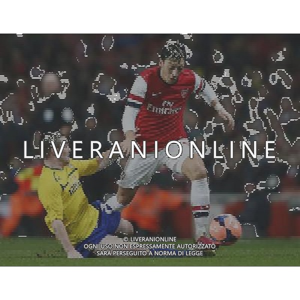 (140125) -- LONDON, Jan. 25, 2014 () -- Mesut Ozil (R) of Arsenal vies with John Fleck of Coventry City during FA Cup Fourth Round match between Arsenal and Coventry City at Emirates Stadium in London, Britain on Jan. 24, 2014. Arsenal won 4-0. (/Wang Lili) FOR EDITORIAL USE ONLY. NOT FOR SALE FOR MARKETING OR ADVERTISING CAMPAIGNS. NO USE WITH UNAUTHORIZED AUDIO, VIDEO, DATA, FIXTURE LISTS, CLUBLEAGUE LOGOS OR LIVE SERVICES. ONLINE IN-MATCH USE LIMITED TO 45 IMAGES, NO VIDEO EMULATION. NO USE IN BETTING, GAMES OR SINGLE CLUBLEAGUEPLAYER PUBLICATIONS. AG ALDO LIVERANI SAS ONLY ITALY