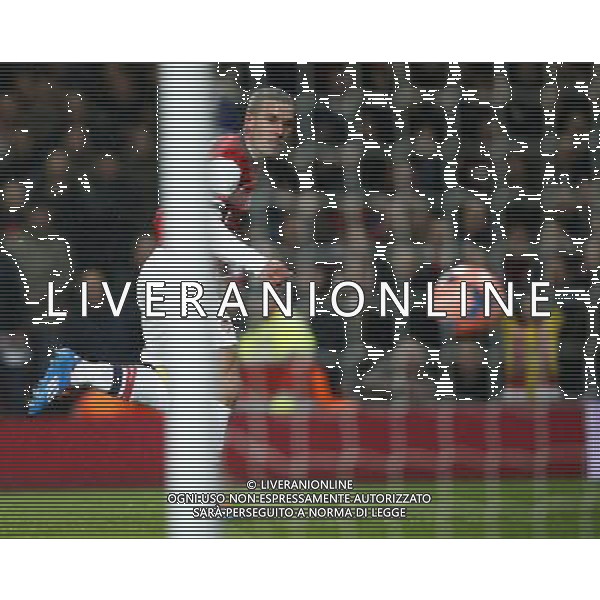 (140125) -- LONDON, Jan. 25, 2014 () -- Lukas Podolski of Arsenal scores his first goal after passing Joe Murphy, the goalie of Coventry City during FA Cup Fourth Round match between Arsenal and Coventry City at Emirates Stadium in London, Britain on Jan. 24, 2014. Arsenal won 4-0. (/Wang Lili) FOR EDITORIAL USE ONLY. NOT FOR SALE FOR MARKETING OR ADVERTISING CAMPAIGNS. NO USE WITH UNAUTHORIZED AUDIO, VIDEO, DATA, FIXTURE LISTS, CLUBLEAGUE LOGOS OR LIVE SERVICES. ONLINE IN-MATCH USE LIMITED TO 45 IMAGES, NO VIDEO EMULATION. NO USE IN BETTING, GAMES OR SINGLE CLUBLEAGUEPLAYER PUBLICATIONS. AG ALDO LIVERANI SAS ONLY ITALY
