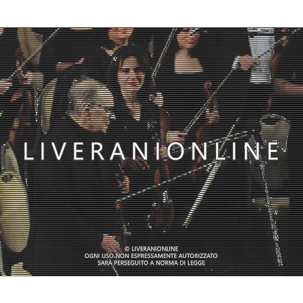 (140126) -- BAKU, Jan. 26, 2014 () -- World-famous Italian musician Ennio Morricone (front) performs with his orchestra at a concert in Azerbaijan\'s capital Baku on Jan. 25, 2014. Oscar winner Ennio Morricone held his first concert in Azerbaijan to celebrate the 85th anniversary of country\'s grand concert. (/Tofik Babayev) AG ALDO LIVERANI SAS ONLY ITALY