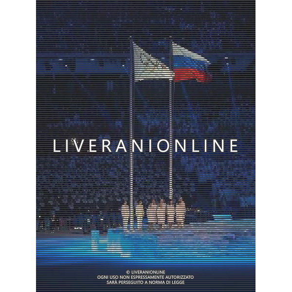 07.02.2014, Olympiastadion Fischt, Adler, RUS, Sochi 2014, ErÃ¶ffnungsfeier der XXII. Olympischen Winterspiele, im Bild die Olympische und Russische Fahne wehen im Stadion // the Olympic and Russian flag waving in the stadium during the Opening Ceremony of the Olympic Winter Games Sochi 2014 at the Fisht Olympic Stadium in Adler, Russia on 2014/02/07. EXPA Pictures Â© 2014, PhotoCredit: EXPA/ Johann Groder Â©PHOTOSHOT/AGENZIA ALDO LIVERANI SAS - ITALY ONLY - Cerimonia di apertura dei 22mi Giochi Olimpici Invernali Olimpiadi di Sochi, Russia 7 febbraio 2014