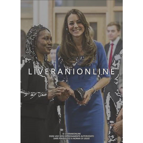 The Duchess of Cambridge talks head teacher Gloria Lowe at Northolt high school near London. The Duchess of Cambridge has been Royal Patron of The Art Room since January 2012, reflecting her interest in the arts and her particular interest in using the creativity of art to enrich the lives of young people. The Art Room is a national charity which offers art as therapy to children and young people aged five to 16 who are facing challenges in their lives. Art Room practitioners support students and help them grow their self-confidence, self-esteem and engagement with education through art. The Art Room has studios in Oxford and London and Northolt High School was chosen for their seventh Art Room venue due to its vibrant learning community serving a diverse population. It is a reflection of the school\'s commitment to provide support to meet the range of needs of the students in the school. The new studio will serve up to 60 students per week, initially from Northolt High School and in future months will also work with children from neighbouring schools in Ealing borough. ©photoshot/AGENZIA ALDO LIVERANI SAS - ITALY ONLY - REALI INGLESI: Kate Middleton duchessa di Cambridge parla agli studenti e al personale al liceo Northolt nei pressi di Londra