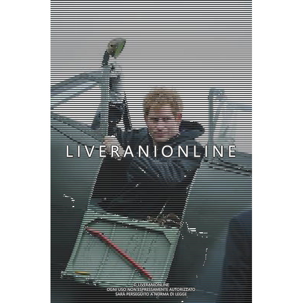Prince Harry visits the Boultbee Flight Academy on 15/02/2014 at Goodwood Motor Circuit, Goodwood. The Prince sat in the cockpit of a Spitfire aircraft as it\'s engines were turned over outside a hanger. ©photoshot/AGENZIA ALDO LIVERANI SAS - ITALY ONLY - EDITORIAL USE ONLY ©photoshot/AGENZIA ALDO LIVERANI SAS - ITALY ONLY - REALI INGLESI: Il principe Harry d\'inghilterra in visita all\'accademia di volo Boultbee a Goodwood Motor Circuit 15 febbraio 2014