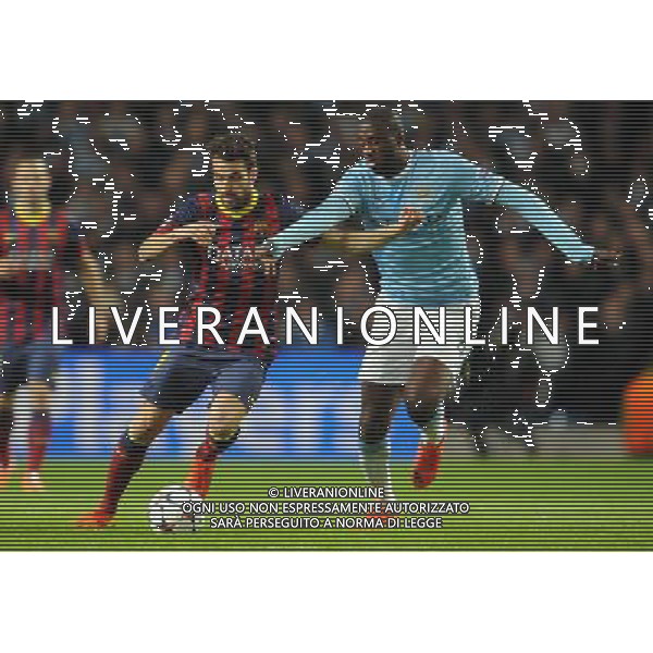CESC FABREGAS \' YAYA TOURE MANCHESTER CITY V BARCELONA FC MANCHESTER CITY V BARCELONA FC, CHAMPIONS LEAGUE ETIHAD STADIUM, MANCHESTER, ENGLAND 18 February 2014 GAT78678 CHAMPIONS LEAGUE 1ST LEG 18/02/14 WARNING! This Photograph May Only Be Used For Newspaper And/Or Magazine Editorial Purposes. May Not Be Used For Publications Involving 1 player, 1 Club Or 1 Competition Without Written Authorisation From Football DataCo Ltd. For Any Queries, Please Contact Football DataCo Ltd on +44 (0) 207 864 9121 AG ALDO LIVERANI SAS ONLY ITALY