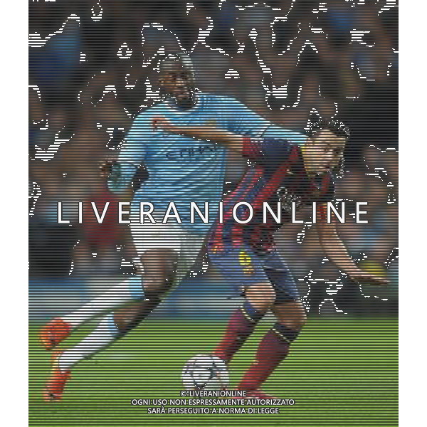 YAYA TOURE \' XAVI MANCHESTER CITY V BARCELONA FC MANCHESTER CITY V BARCELONA FC, CHAMPIONS LEAGUE ETIHAD STADIUM, MANCHESTER, ENGLAND 18 February 2014 GAT78685 CHAMPIONS LEAGUE 1ST LEG 18/02/14 WARNING! This Photograph May Only Be Used For Newspaper And/Or Magazine Editorial Purposes. May Not Be Used For Publications Involving 1 player, 1 Club Or 1 Competition Without Written Authorisation From Football DataCo Ltd. For Any Queries, Please Contact Football DataCo Ltd on +44 (0) 207 864 9121 AG ALDO LIVERANI SAS ONLY ITALY