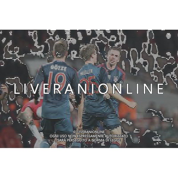 19.02.2014, Emirates Stadion, London, ENG, UEFA CL, FC Arsenal vs FC Bayern Muenchen, Achtelfinale, im Bild l-r: Torjubel von Mario GOETZE #19 (FC Bayern Muenchen), Thomas MUELLER #25 (FC Bayern Muenchen), Philipp LAHM #21 (FC Bayern Muenchen) // during the UEFA Champions League Round of 16 match between FC Arsenal and FC Bayern Munich at the Emirates Stadion in London, Great Britain on 2014/02/19. EXPA Pictures © 2014, PhotoCredit: EXPA/ Eibner-Pressefoto/ Kolbert *****ATTENTION - OUT of GER***** AG ALDO LIVERANI SAS ONLY ITALY
