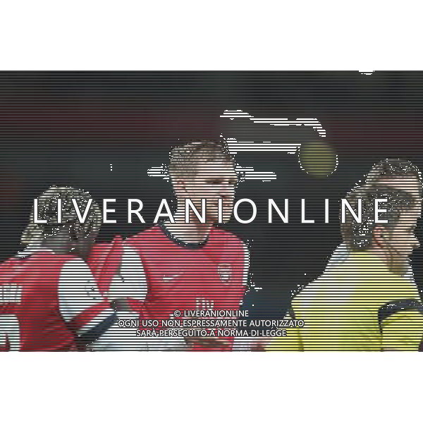 19.02.2014, Emirates Stadion, London, ENG, UEFA CL, FC Arsenal vs FC Bayern Muenchen, Achtelfinale, im Bild Per MERTESACKER #4 (FC Arsenal London) protestiert ueber den elfmeter // during the UEFA Champions League Round of 16 match between FC Arsenal and FC Bayern Munich at the Emirates Stadion in London, Great Britain on 2014/02/19. EXPA Pictures © 2014, PhotoCredit: EXPA/ Eibner-Pressefoto/ Kolbert *****ATTENTION - OUT of GER***** AG ALDO LIVERANI SAS ONLY ITALY