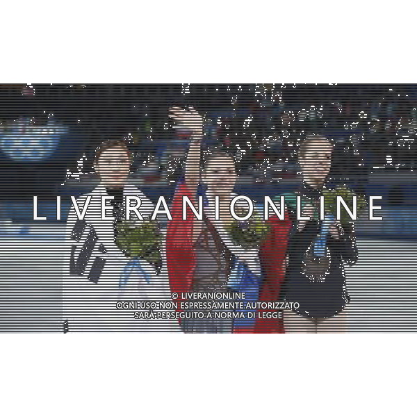 (140220) -- SOCHI, Feb. 20, 2014 () -- Gold medalist Russia\'s Adelina Sotnikova (C), silver medalist South Korea\'s Kim Yuna (L) and bronze medalist Italy\'s Carolina Kostner pose during the flower ceremony after the ladies\' figure skating free skating event at the 2014 Sochi Winter Olympic Games in Sochi, Russia, Feb. 20, 2014. (/Wang Lili) ©PHOTOSHOT/AGENZIA ALDO LIVERANI SAS - ITALY ONLY - 22mi Giochi Olimpici Invernali Olimpiadi di Sochi, Russia febbraio 2014