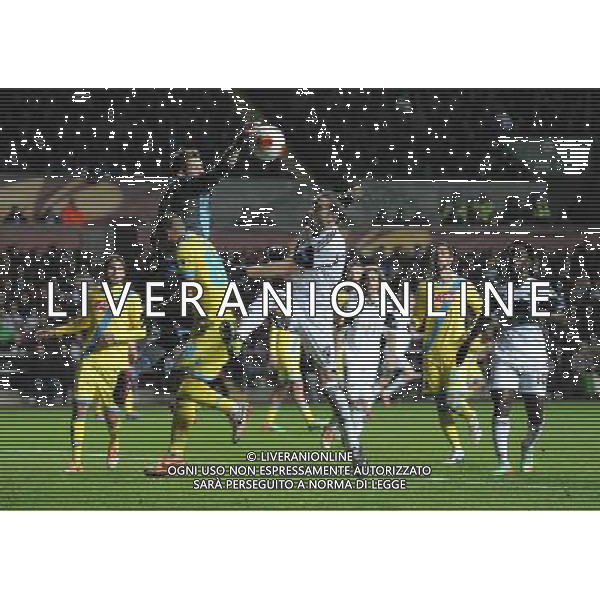 Napoli\'s Rafael punches clear from the challenging Swansea City\'s Chico Photo by Ian Cook/CameraSport Football - UEFA Europa League Round of 32 - Swansea City v Napoli - Thursday 20th February 2014 - The Liberty Stadium - Swansea © CameraSport - 43 Linden Ave. Countesthorpe. Leicester. England. LE8 5PG - Tel: +44 (0) 116 277 4147 - admin@camerasport.com - www.camerasport.com AG ALDO LIVERANI SAS ONLY ITALY