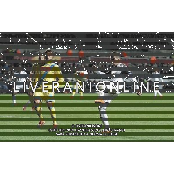 Swansea City\'s Pablo Hernandez crosses the ball into the box Photo by Ian Cook/CameraSport Football - UEFA Europa League Round of 32 - Swansea City v Napoli - Thursday 20th February 2014 - The Liberty Stadium - Swansea © CameraSport - 43 Linden Ave. Countesthorpe. Leicester. England. LE8 5PG - Tel: +44 (0) 116 277 4147 - admin@camerasport.com - www.camerasport.com AG ALDO LIVERANI SAS ONLY ITALY