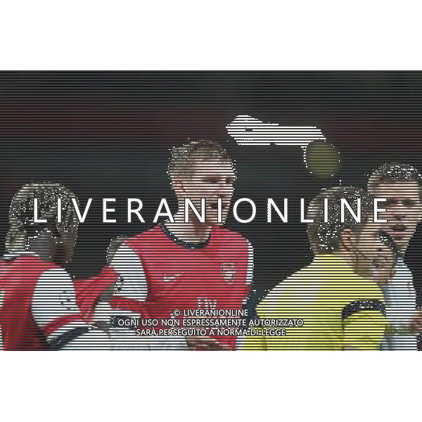 19.02.2014, Emirates Stadion, London, ENG, UEFA CL, FC Arsenal vs FC Bayern Muenchen, Achtelfinale, im Bild Per MERTESACKER #4 (FC Arsenal London) protestiert ueber den elfmeter // during the UEFA Champions League Round of 16 match between FC Arsenal and FC Bayern Munich at the Emirates Stadion in London, Great Britain on 2014/02/19. EXPA Pictures © 2014, PhotoCredit: EXPA/ Eibner-Pressefoto/ Kolbert *****ATTENTION - OUT of GER***** ©PHOTOSHOT/AGENZIA ALDO LIVERANI SAS - ITALY ONLY - EDITORIAL USE ONLY - ARSENAL Vs BAYERN MONACO CHAMPIONS LEAGUE