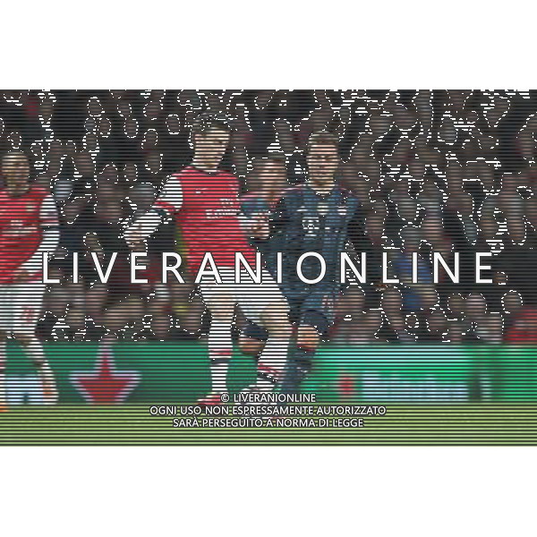 19.02.2014, Emirates Stadion, London, ENG, UEFA CL, FC Arsenal vs FC Bayern Muenchen, Achtelfinale, im Bild l-r: im Zweikampf, Aktion, mit Laurent KOSCIELNY #6 (FC Arsenal London), Mario GOETZE #19 (FC Bayern Muenchen) // during the UEFA Champions League Round of 16 match between FC Arsenal and FC Bayern Munich at the Emirates Stadion in London, Great Britain on 2014/02/19. EXPA Pictures © 2014, PhotoCredit: EXPA/ Eibner-Pressefoto/ Kolbert *****ATTENTION - OUT of GER***** ©PHOTOSHOT/AGENZIA ALDO LIVERANI SAS - ITALY ONLY - EDITORIAL USE ONLY - ARSENAL Vs BAYERN MONACO CHAMPIONS LEAGUE