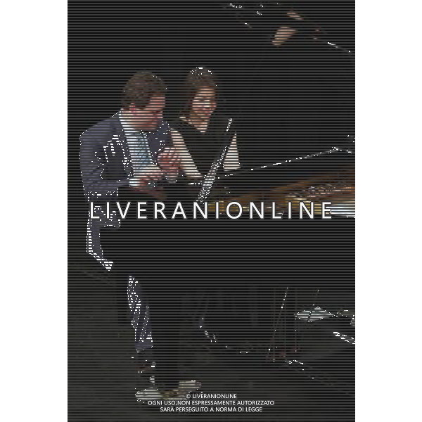 (140226) -- FRANKFURT, Feb. 26, 2014 () -- The four-hand jazz piano duo Italian pianist Paolo Alderighi (L) and U.S. pianist Stephanie Trick perform at the International Theater in Frankfurt, Germany, on Feb. 25, 2014. Paolo and Stephanie are a four-hands jazz piano duo dedicated to playing the songs of the Swing Era, along with some ragtime and blues. Although their styles differ and although it is not easy as jazz musicians to play in four hands on one piano without being redundant or interfering with each other\'s playing, Stephanie Trick and Paolo Alderighi manage this near-impossible feat without getting in each other\'s way. Their playing is complementary and mutually inspiring with plenty of fireworks being felt along the way. (/Luo Huanhuan) AG ALDO LIVERANI SAS ONLY ITALY