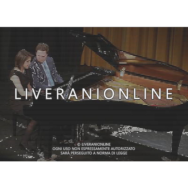 (140226) -- FRANKFURT, Feb. 26, 2014 () -- The four-hand jazz piano duo Italian pianist Paolo Alderighi (R) and U.S. pianist Stephanie Trick perform at the International Theater in Frankfurt, Germany, on Feb. 25, 2014. Paolo and Stephanie are a four-hands jazz piano duo dedicated to playing the songs of the Swing Era, along with some ragtime and blues. Although their styles differ and although it is not easy as jazz musicians to play in four hands on one piano without being redundant or interfering with each other\'s playing, Stephanie Trick and Paolo Alderighi manage this near-impossible feat without getting in each other\'s way. Their playing is complementary and mutually inspiring with plenty of fireworks being felt along the way. (/Luo Huanhuan) AG ALDO LIVERANI SAS ONLY ITALY