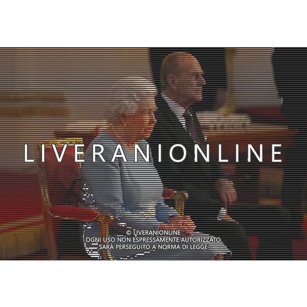LONDON, ENGLAND - FEBRUARY 27: Queen Elizabeth II and Prince Phillip, Duke of Edinburgh prepare to present awards for the Queen\'s Anniversary Prizes for Higher and Further Education at Buckingham Palace on February 27, 2014 in London, England. AG ALDO LIVERANI SAS ONLY ITALY