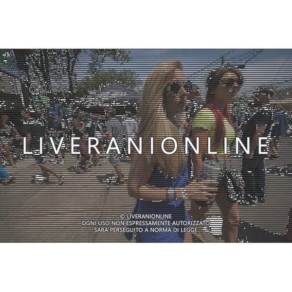 Hipsters drink beer and and buy food from food trucks at the annual Bushwick Block Party in the Bushwick neighborhood of Brooklyn on Saturday, July 27, 2013. Filmmaker Spike Lee recently spoke against gentrification by hipsters in various gentrifying neighborhoods. (ŒŒæRichard B. Levine) ©PHOTOSHOT/AGENZIA ALDO LIVERANI SAS - ITALY ONLY - EDITORIAL USE ONLY