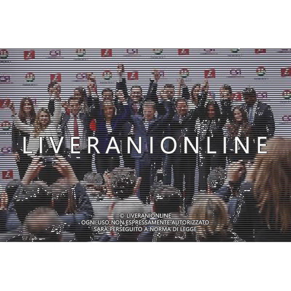 (140304) -- BOGOTA, March 4, 2014 () -- Colombia\'s President Juan Manuel Santos (C) raises hands with several heads of political parties and his campaign team during the signing of his candidacy for the upcoming presidential elections in Bogota, capital of Colombia, on March 4, 2014. Colombian President Juan Manuel Santos along with his vice president candidate German Vargas Lleras registered his candidacy for presidential elections which will be held on May 25. (/Jhon Paz) (jg) (ah) AG ALDO LIVERANI SAS ONLY ITALY