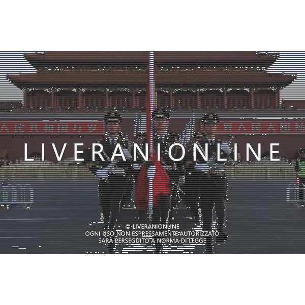 (140305) -- BEIJING, March 5, 2014 () -- A flag-raising ceremony is held at the Tian\'anmen Square in Beijing, capital of China, March 5, 2014. The second session of China\'s 12th National People\'s Congress (NPC), the national legislature, opened in Beijing on March 5. (/Liu Changlong) (zkr)