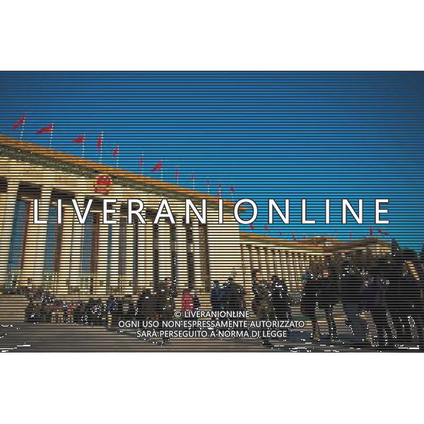 (140305) -- BEIJING, March 5, 2014 () -- Journalists queue to enter the Great Hall of the People, venue of the second session of China\'s 12th National People\'s Congress (NPC), in Beijing, capital of China, March 5, 2014. The second session of the 12th NPC, the national legislature, opened in Beijing on March 5. (/Liu Jinhai) (zkr) AG ALDO LIVERANI SAS ONLY ITALY