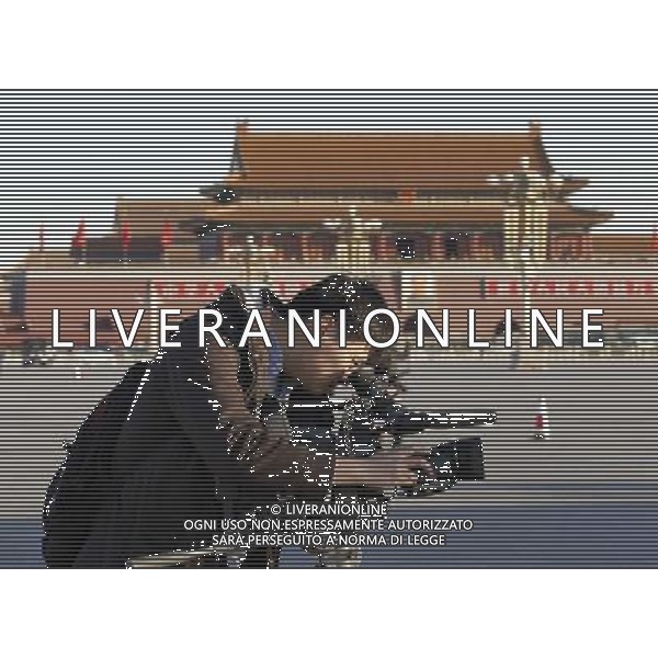 (140305) -- BEIJING, March 5, 2014 () -- A journalist works at the Tian\'anmen Square in Beijing, capital of China, March 5, 2014. The second session of China\'s 12th National People\'s Congress (NPC), the national legislature, opened in Beijing on March 5. (/Xing Guangli) (zkr) AG ALDO LIVERANI SAS ONLY ITALY
