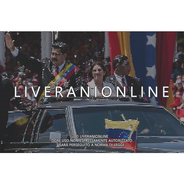 (140306) -- CARACAS, March 6, 2014 () -- Venezuelan President Nicolas Maduro (L) waves as he arrives to the civic-military parade in honor of late Venezuelan President Hugo Chavez to mark the first anniversary of his death at Paseo Los Proceres in Caracas, Venezuela, on March 5, 2014. (/Boris Vergara) (fnc) (ce) AG ALDO LIVERANI SAS ONLY ITALY