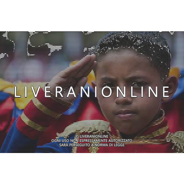 (140306) -- CARACAS, March 6, 2014 () -- A child attends the civic-military parade in honor of late Venezuelan President Hugo Chavez to mark the first anniversary of his death at Paseo Los Proceres in Caracas, Venezuela, on March 5, 2014. (/Boris Vergara) (fnc) (ce) AG ALDO LIVERANI SAS ONLY ITALY
