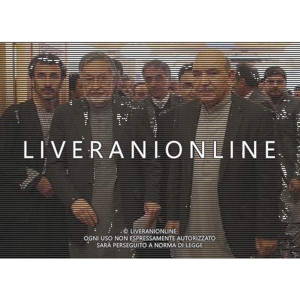 (140306) -- KABUL, March 6, 2014 () -- President Hamid Karzai\'s elder brother Abdul Qayum Karzai (front R) arrives with presidential candidate Zalmai Rassoul (front L) during a joint press conference in Kabul, Afghanistan, on March 6, 2014. President Hamid Karzai\'s elder brother Abdul Qayum Karzai quitted Afghan presidential race on Thursday and threw his weight behind former foreign minister Zalmai Rassoul in the presidential elections scheduled for April 5. (/Ahmad Massoud) (lyx) AG ALDO LIVERANI SAS ONLY ITALY