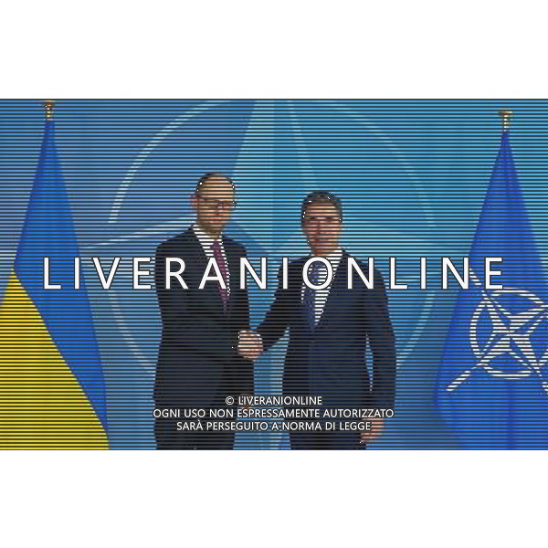 (140307) -- BRUSSELS, March 7, 2014 () -- Ukrainian Prime Minister Arseniy Yatsenyuk (L) shakes hands with NATO Secretary General Anders Fogh Rasmussen during a press conference at the NATO headquarters in Brussels, capital of Belgium, March 6, 2014. (/Gong Bing) AG ALDO LIVERANI SAS ONLY ITALY
