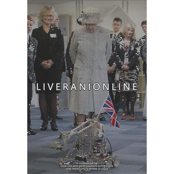 Britain\'s Queen Elizabeth II looks at a robotic demonstration as she visits Reed\'s School, in Cobham, England, Thursday, March, 6, 2014. The school originally founded in 1813 in the east end of London, as the London Orphan Asylum. The Queen who is Patron of the school is visiting to help it celebrate is bicentenary. AG ALDO LIVERANI SAS ONLY ITALY