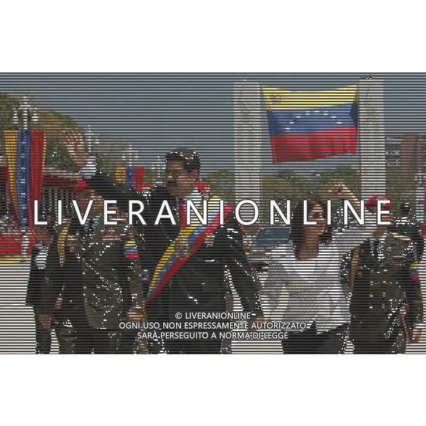 (140305) -- CARACAS, March 5, 2014 () -- Venezuelan President Nicolas Maduro (L front) and his wife Cilia Flores ( R front) wave as they arrive to the civic-military parade in honor of late Venezuelan President Hugo Chavez, on the framework of the first anniversary of his death, at Paseo Los Proceres, in Caracas, Venezuela, on March 5, 2014. (/AVN) AG ALDO LIVERANI SAS ONLY ITALY