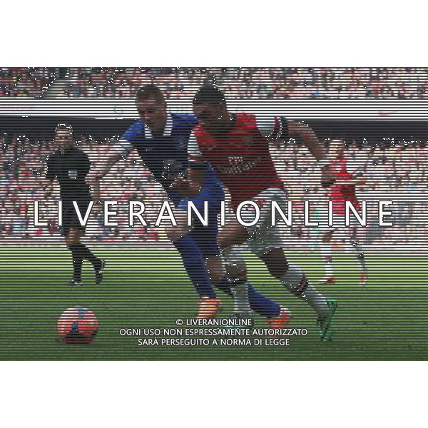 Arsenal\'s Alex Oxlade-Chamberlain despite the attentions of Everton\'s John Stones Photo by Kieran Galvin/CameraSport Football - FA Challenge Cup Quarter-Final - Arsenal v Everton - Saturday 8th March 2014 - Emirates Stadium - London © CameraSport - 43 Linden Ave. Countesthorpe. Leicester. England. LE8 5PG - Tel: +44 (0) 116 277 4147 - admin@camerasport.com - www.camerasport.com AG ALDO LIVERANI SAS ONLY ITALY