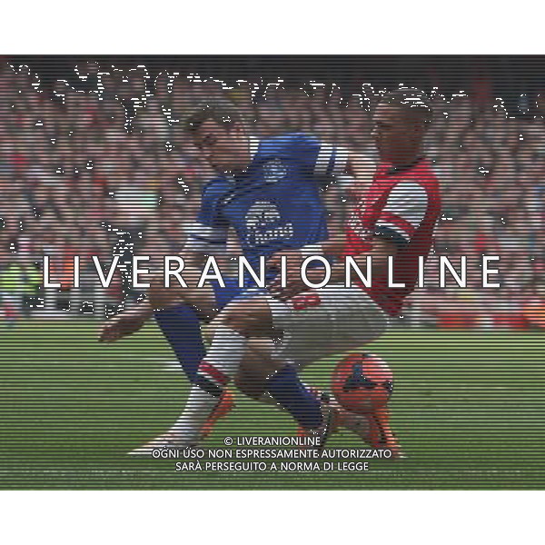 Arsenal\'s Kieran Gibbs despite the attentions of Everton\'s Seamus Coleman Photo by Kieran Galvin/CameraSport Football - FA Challenge Cup Quarter-Final - Arsenal v Everton - Saturday 8th March 2014 - Emirates Stadium - London © CameraSport - 43 Linden Ave. Countesthorpe. Leicester. England. LE8 5PG - Tel: +44 (0) 116 277 4147 - admin@camerasport.com - www.camerasport.com AG ALDO LIVERANI SAS ONLY ITALY