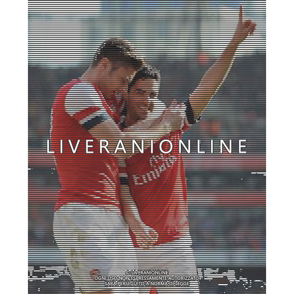 MIKEL ARTETA SCORES PENALTY AND CELEBRATES WITH OLIVIER GIROUD ARSENAL FC V EVERTON FC ARSENAL FC V EVERTON FC, THE BUDWEISER FA CUP QUARTER FINAL EMIRATES STADIUM, LONDON, ENGLAND 08 March 2014 GAT79227 THE BUDWEISER FA CUP QUARTER FINALS WARNING! This Photograph May Only Be Used For Newspaper And/Or Magazine Editorial Purposes. May Not Be Used For Publications Involving 1 player, 1 Club Or 1 Competition Without Written Authorisation From Football DataCo Ltd. For Any Queries, Please Contact Football DataCo Ltd on +44 (0) 207 864 9121 AG ALDO LIVERANI SAS ONLY ITALY