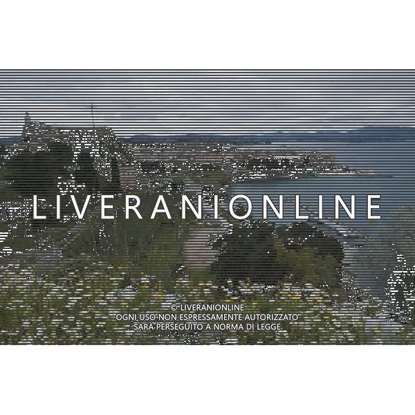 (140308) -- CORFU, Mar. 8, 2014 () -- Photo taken on March 8, 2014 shows a scenery of the old town of Corfu, Greece. The Old Town of Corfu, on the Greek Island of Corfu off the western coasts of Albania and Greece, is located in a strategic position at the entrance of the Adriatic Sea, and has its roots in the 8th century BC. The three forts of the town, designed by renowned Venetian engineers, were used from 1386 to 1797 by Venice to defend the maritime trading interests of the Republic of Venice against the Ottoman Empire. In the course of time, the forts were repaired and partly rebuilt several times, more recently under British rule in the 19th century. The mainly neoclassical housing stock of the Old Town is partly from the Venetian period, partly of later construction, notably the 19th century. As a fortified Mediterranean port, Corfu\' s urban and port ensemble is notable for its high level of integrity and authenticity. The ensemble was inscribed as UNESCO World Heritage Site in 2007. It is the most recent inscribed among the 17 UNESCO World Heritage Sites in Greece. (/Liu Yongqiu) ©photoshot/AGENZIA ALDO LIVERANI SAS - ITALY ONLY - Vedute della citta\' vecchia di Corfu al largo delle coste occidentali di Albania e Grecia, si trova dentro una posizione strategica all\'ingresso del Mare Adriatico, iscritta come patrimonio mondiale dell\'UNESCO nel 2007