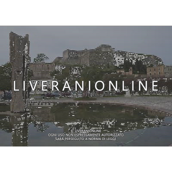 (140308) -- CORFU, Mar. 8, 2014 () -- Photo taken on March 8, 2014 shows a scenery of the old town of Corfu, Greece. The Old Town of Corfu, on the Greek Island of Corfu off the western coasts of Albania and Greece, is located in a strategic position at the entrance of the Adriatic Sea, and has its roots in the 8th century BC. The three forts of the town, designed by renowned Venetian engineers, were used from 1386 to 1797 by Venice to defend the maritime trading interests of the Republic of Venice against the Ottoman Empire. In the course of time, the forts were repaired and partly rebuilt several times, more recently under British rule in the 19th century. The mainly neoclassical housing stock of the Old Town is partly from the Venetian period, partly of later construction, notably the 19th century. As a fortified Mediterranean port, Corfu\' s urban and port ensemble is notable for its high level of integrity and authenticity. The ensemble was inscribed as UNESCO World Heritage Site in 2007. It is the most recent inscribed among the 17 UNESCO World Heritage Sites in Greece. (/Liu Yongqiu) ©photoshot/AGENZIA ALDO LIVERANI SAS - ITALY ONLY - Vedute della citta\' vecchia di Corfu al largo delle coste occidentali di Albania e Grecia, si trova dentro una posizione strategica all\'ingresso del Mare Adriatico, iscritta come patrimonio mondiale dell\'UNESCO nel 2007